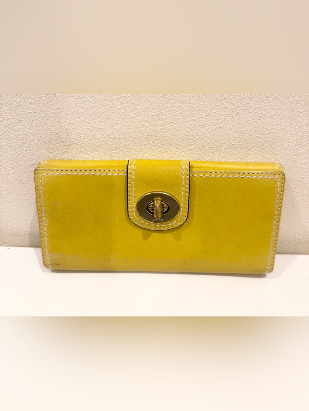 vintage yellow Coach Hampton turnlock wallet